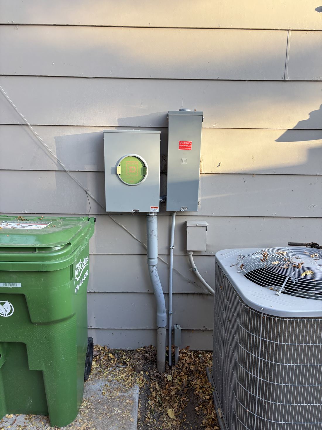 Electrical meter and AC disconnect installed on home exterior